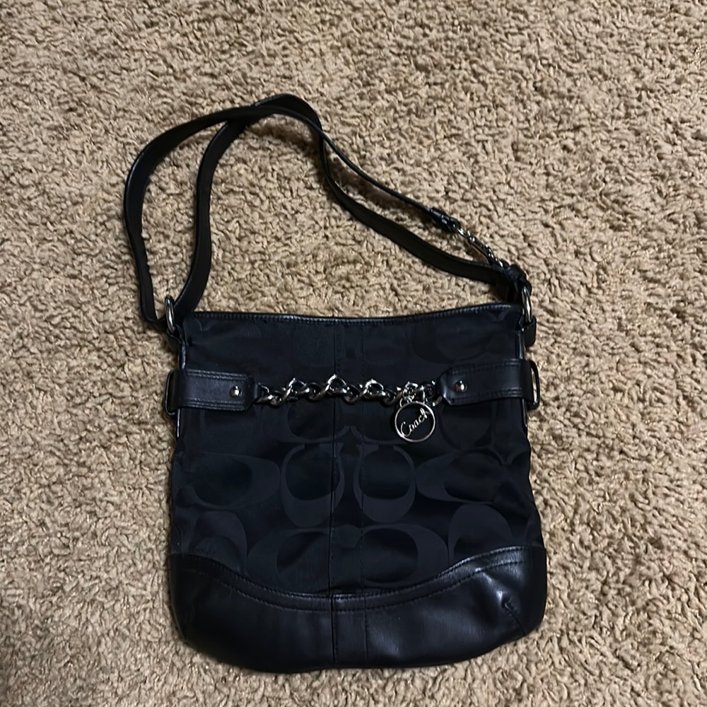 Gently used black Coach logo fabric purse with leather trim